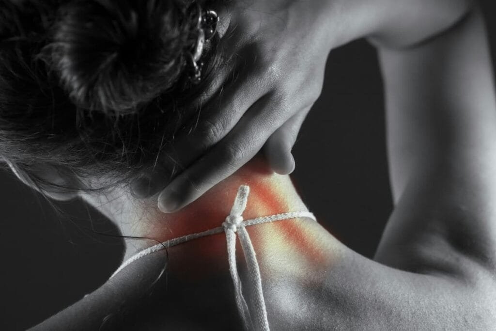 Woman doing a gentle neck stretch in the morning, healthy habit alongside proper pillow support
