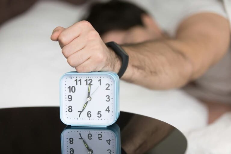 Person feeling exhausted despite a full night of sleep