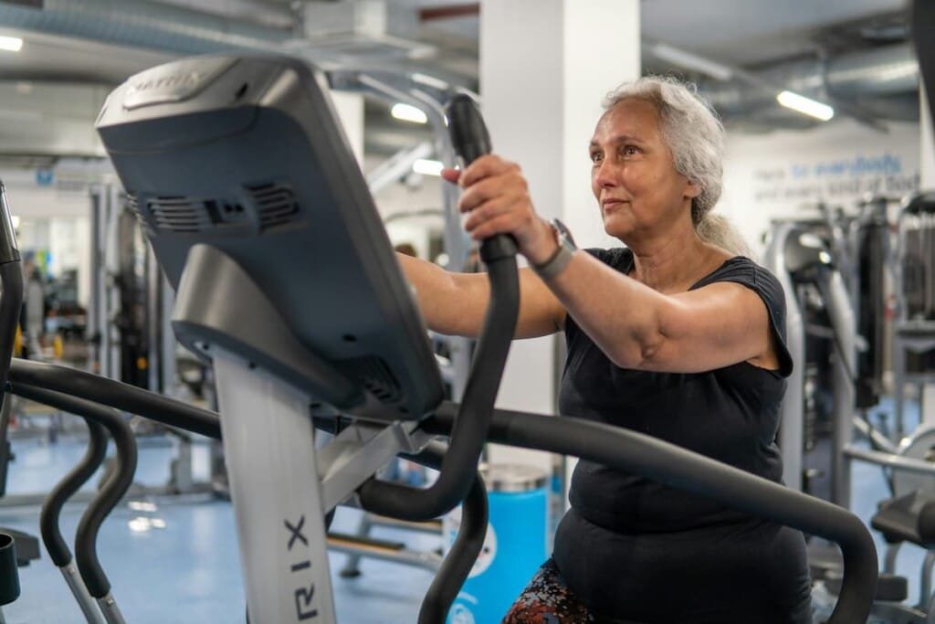 middle-aged woman doing strength training with dumbbells